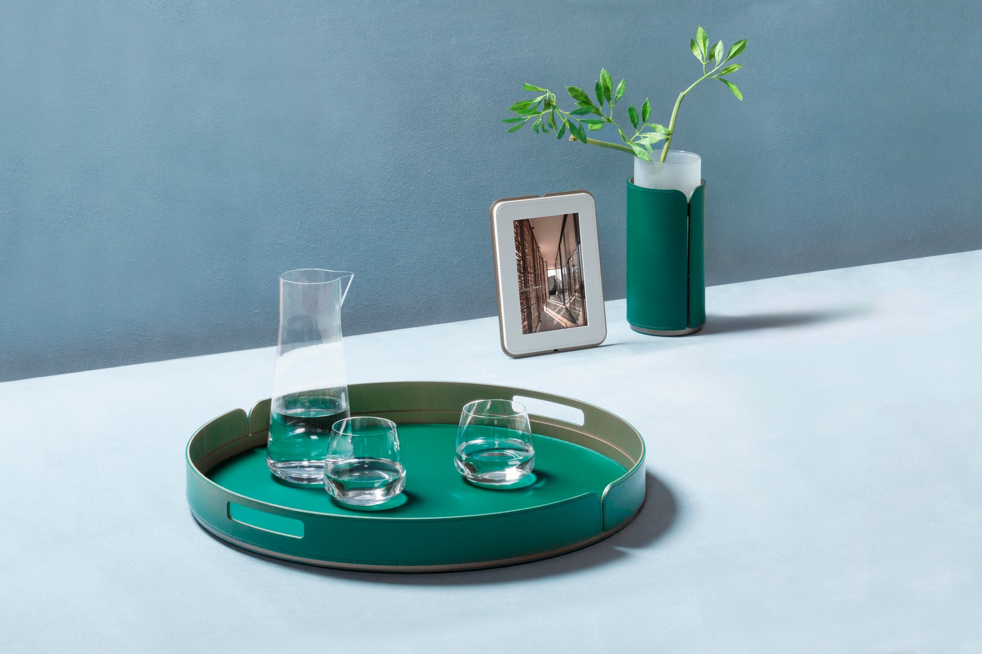 Rudi Tour | Picture Frame: Regenerated leather with aluminum base and smooth, matte finish, designed by Adam D. Tihany for displaying photographs | Decor / Photo Frames | 2Jour Concierge, your luxury lifestyle shop