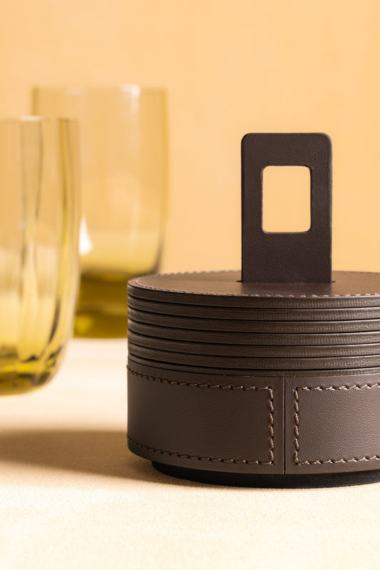 RUDI Nautilus Coaster Holder Round | Inspired by submarine curves with a unique periscope-like handle for easy portability | Crafted from durable Tecnocuoio® Regenerated Leather | Combines nautical aesthetics with essential style | Perfect for organizing coasters or serving drinks | Design by Simone Fanciullacci | Home Decor and Accessories | 2Jour Concierge, your luxury lifestyle shop