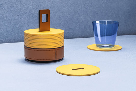 RUDI Nautilus Coaster Holder Round | Inspired by submarine curves with a unique periscope-like handle for easy portability | Crafted from durable Tecnocuoio® Regenerated Leather | Combines nautical aesthetics with essential style | Perfect for organizing coasters or serving drinks | Design by Simone Fanciullacci | Home Decor and Accessories | 2Jour Concierge, your luxury lifestyle shop