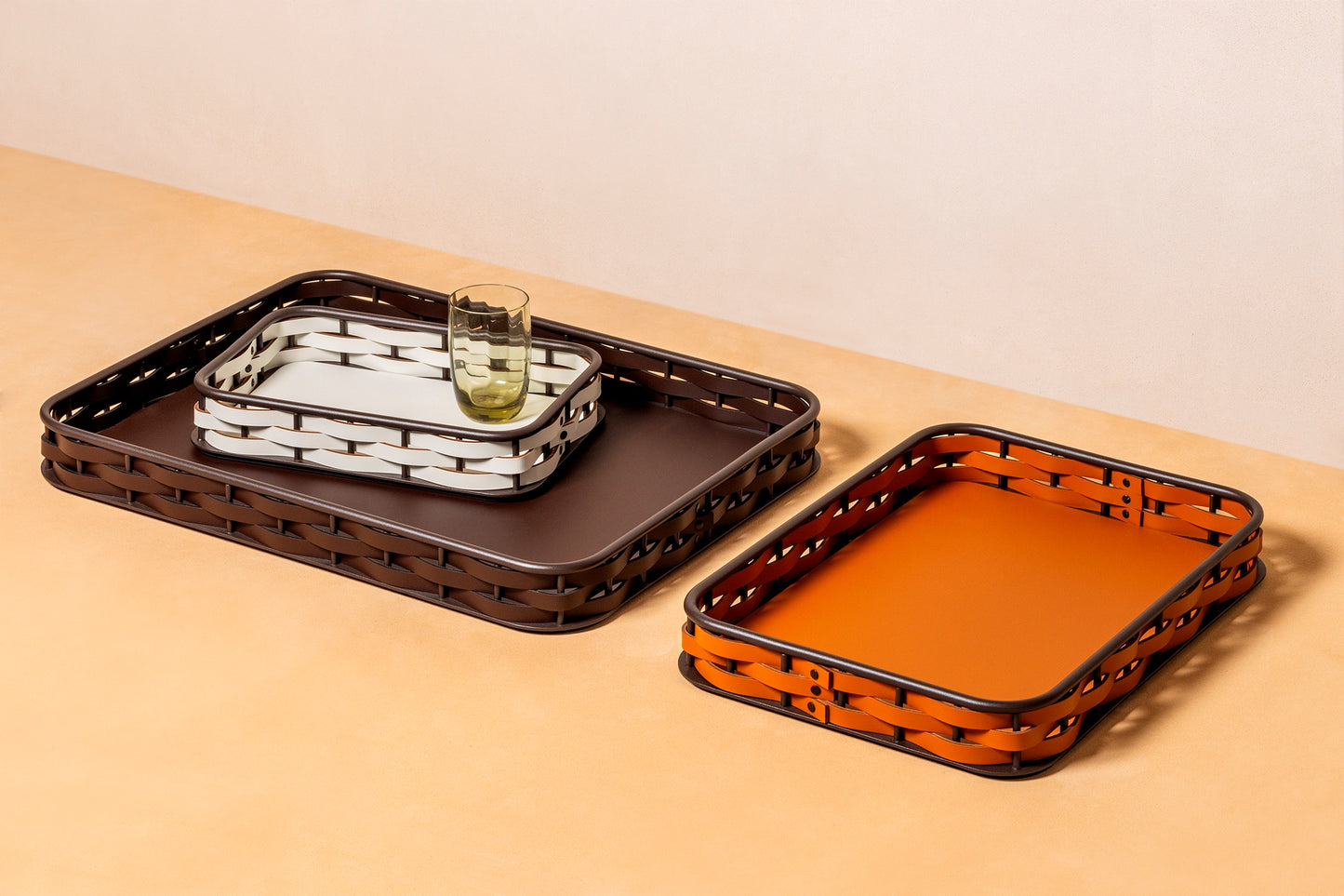 RUDI Nassa Rectangular Trays | A sophisticated blend of style and utility with a dark-stained aluminum structure | Features Tecnocuoio® weaving for contemporary elegance and durability | Available in three sizes | Home Accessories | 2Jour Concierge, your luxury lifestyle shop