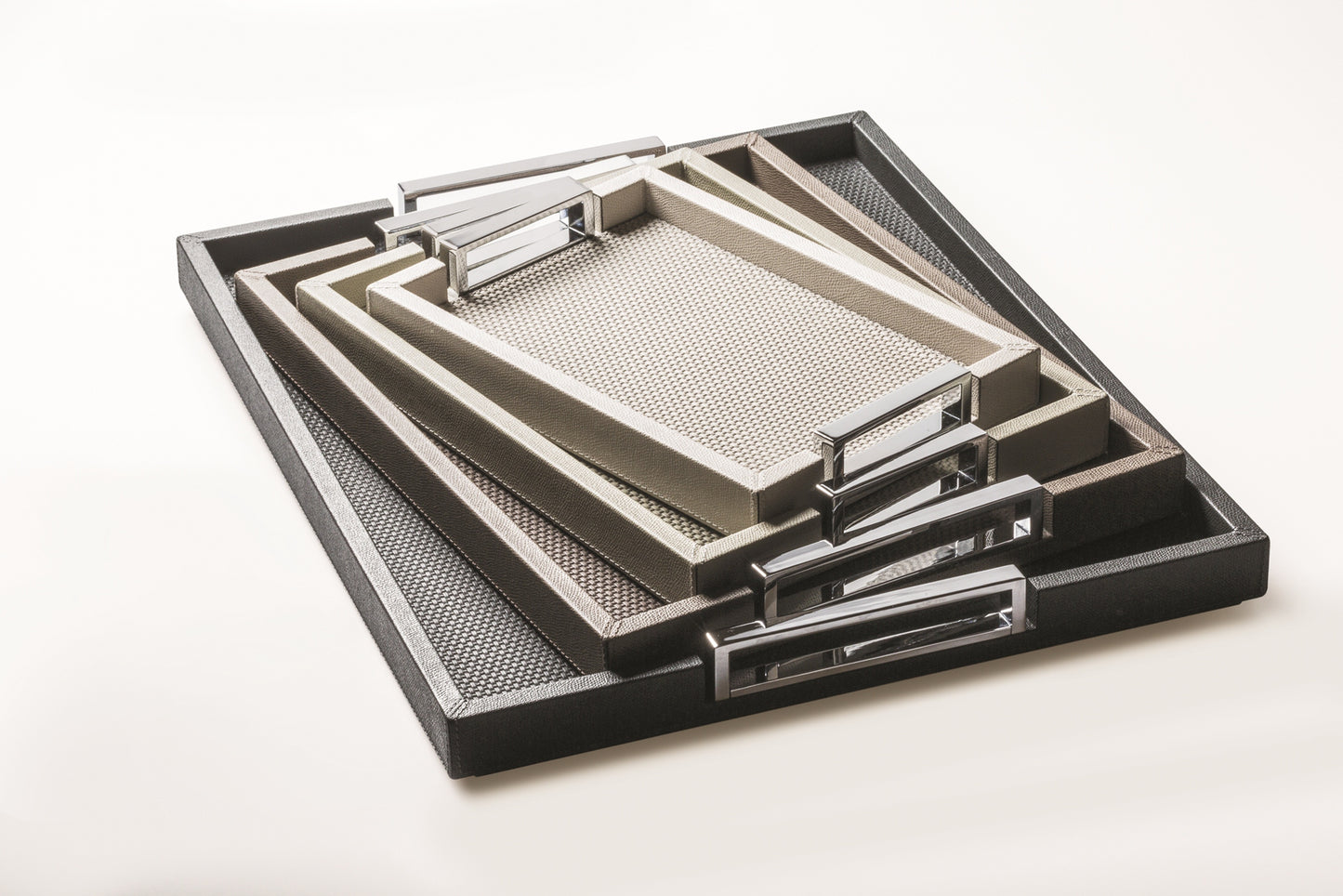 Giobagnara Victor Tray | Contemporary leather-covered tray with a wood core and polished chrome-finish metal handles | Defined by its clean lines and refined materials, perfect for serving or as an elegant surface for display | Crafted in Italy by Giobagnara | Serveware & decor | 2Jour Concierge, your luxury lifestyle shop.