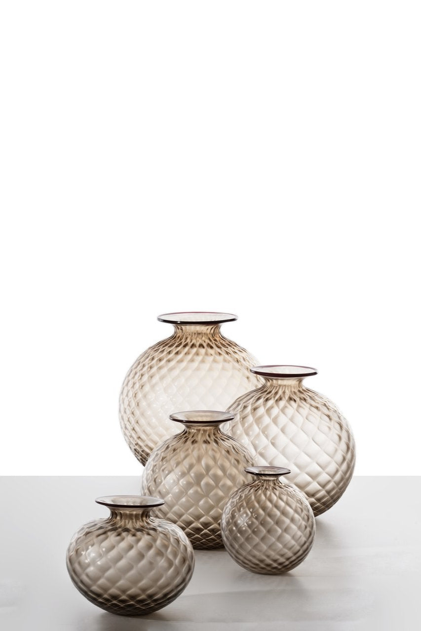Venini Monofiore Balloton Vase | A delicate Murano glass vase recalling ancient treasures and refined personal keepsakes | Hand-blown with the distinctive balloton texture and crowned by a floret-like stopper | First created in 1970, this piece evokes the elegance and intimacy of vintage perfume vials | A poetic accent for sophisticated interiors | Design by Venini | Tableware & decorative objects | 2Jour Concierge, your luxury lifestyle shop