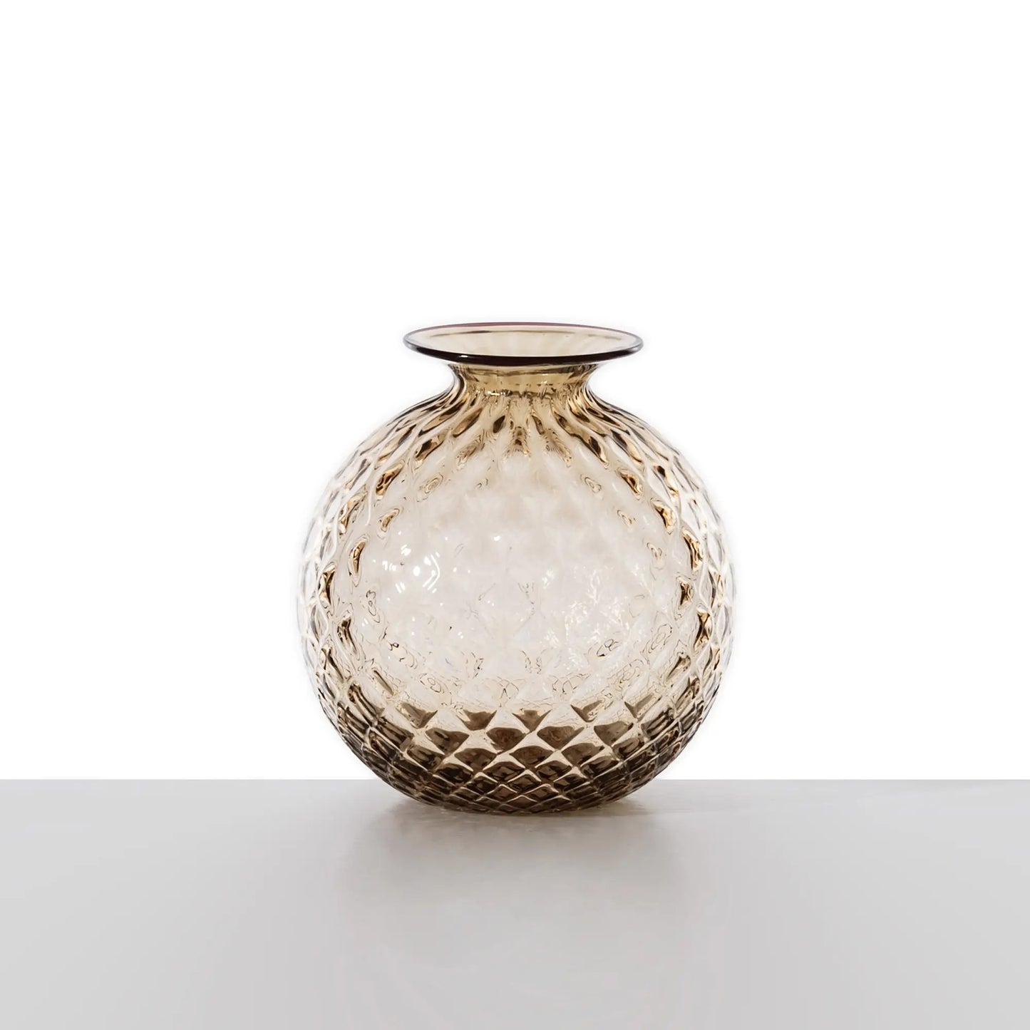 Venini Monofiore Balloton Vase | A delicate Murano glass vase recalling ancient treasures and refined personal keepsakes | Hand-blown with the distinctive balloton texture and crowned by a floret-like stopper | First created in 1970, this piece evokes the elegance and intimacy of vintage perfume vials | A poetic accent for sophisticated interiors | Design by Venini | Tableware & decorative objects | 2Jour Concierge, your luxury lifestyle shop