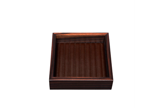 Riviere Febe Ebony | Valet Trays: Macassar ebony structure with linear quilted leather lining, available in multiple shapes | Decor / Valet Trays | 2Jour Concierge, your luxury lifestyle shop | luxury interiors, refined craftsmanship, elegant living, designer trays, boutique hotels, yacht décor, executive interiors