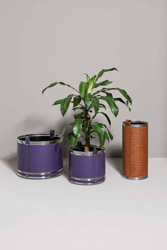 Pinetti Leather-Covered Metal Cachepot With Wheels | Available in chrome, satin brass, or burnished finishes | Covered in leather with a handle for easy use | Equipped with wheels for effortless mobility | Explore Luxury Lifestyle Accessories at 2Jour Concierge, #1 luxury high-end gift & lifestyle shop