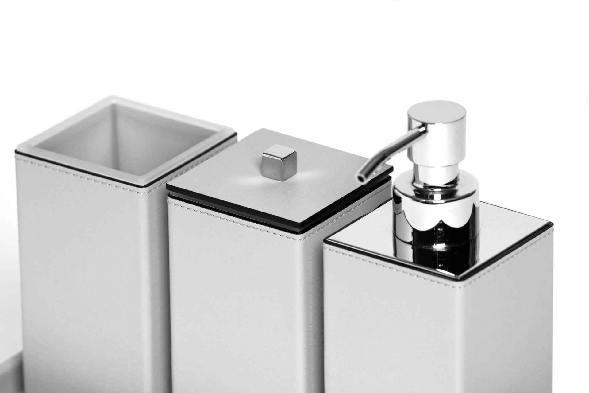 Pinetti | Poseidon Leather-Covered Soap Dispenser: Leather soap dispenser in square and round formats, chrome or shiny gold | Bathroom | 2Jour Concierge, your luxury lifestyle shop | luxury soap dispenser, leather bathroom accessory, Pinetti bathroom set, Poseidon collection, Italian luxury bathroom, designer soap dispenser, chrome gold bathroom accessories, premium vanity accessory
