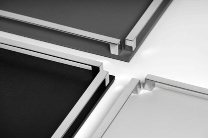 Pinetti Paul | Leather & Metal Trays: Wood base covered in leather, metal handles with chrome, burnished, or gold finish, non-slip base, available in multiple sizes | Tabletop & Bar / Trays | 2Jour Concierge, your luxury lifestyle shop | luxury interiors, refined dining, yacht décor, hospitality décor, elegant serving accessories, boutique hotels, office décor, contemporary living