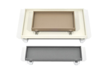 Pinetti | Rialto Leather Tray: Wood base covered in leather with metal feet in chrome, satin, or burnished finish, round and rectangular forms | Tabletop | 2Jour Concierge, your luxury lifestyle shop | luxury tray, Pinetti Rialto, leather tray with feet, raised leather tray, Italian luxury tabletop, designer serving tray, wood leather tray