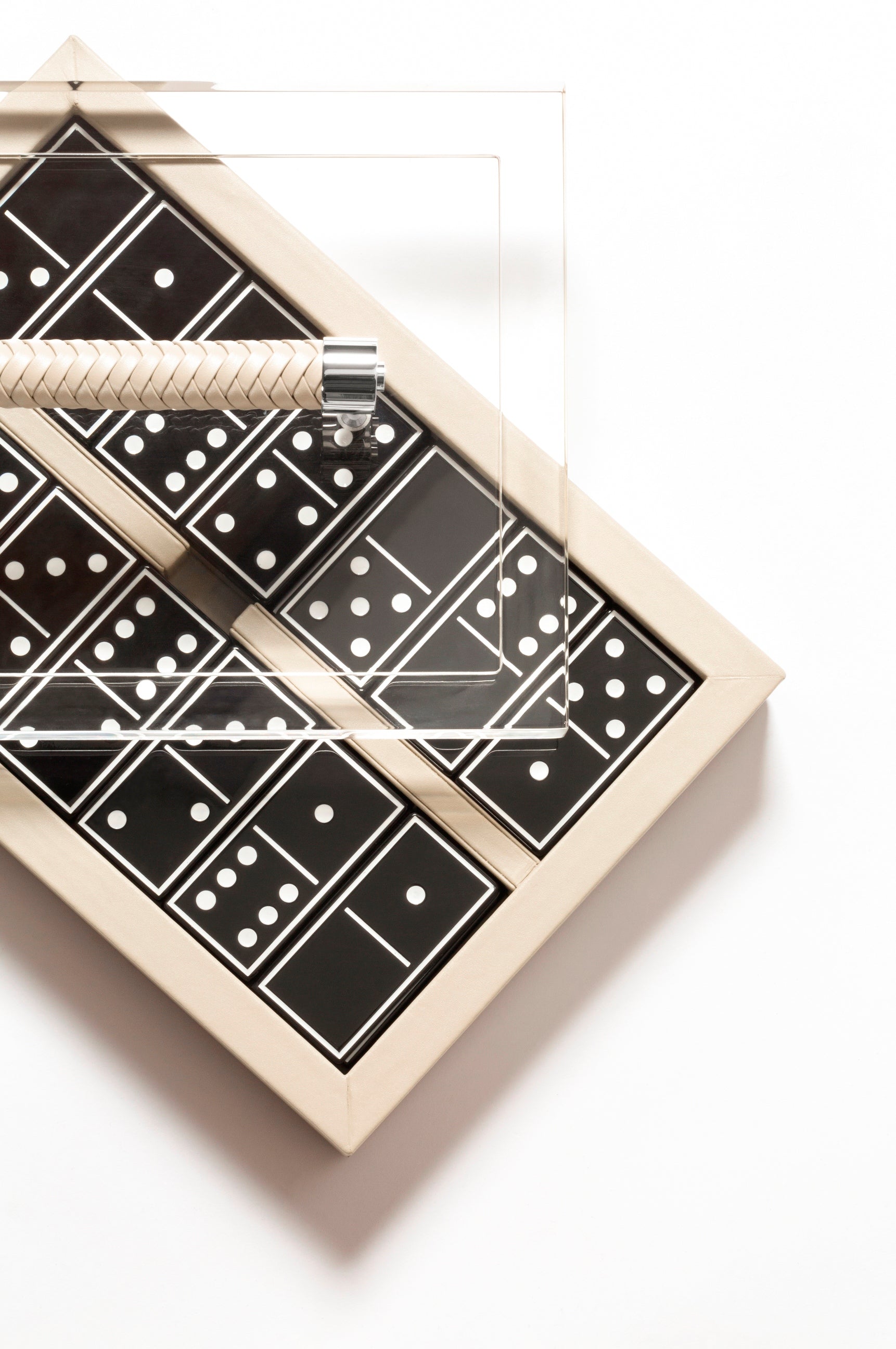 Riviere Diana Leather-Covered Domino Game Set With Acrylic Lid | Elegant Design with Acrylic Lid and Woven Leather Handle | Set Equipped with Highly Resistant Glossy Plexiglass Domino Pieces | Choose Between Black or White Finish | Explore a Range of Luxury Domino Game Sets at 2Jour Concierge, #1 luxury high-end gift & lifestyle shop