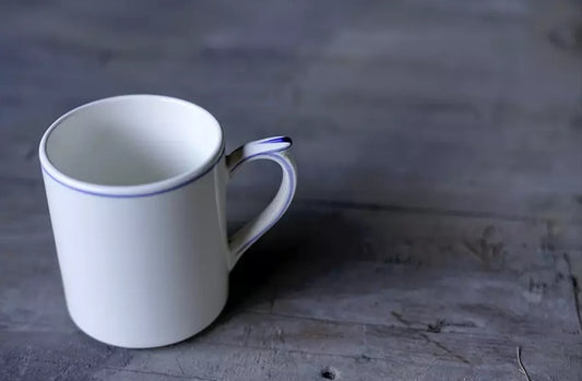 Gien Les Filets | Mug: Fine earthenware with hand-painted rim and smooth, glazed finish, ideal for enjoying tea, coffee, or hot chocolate | Tableware & Serveware / Cups & Mugs | 2Jour Concierge, your luxury lifestyle shop