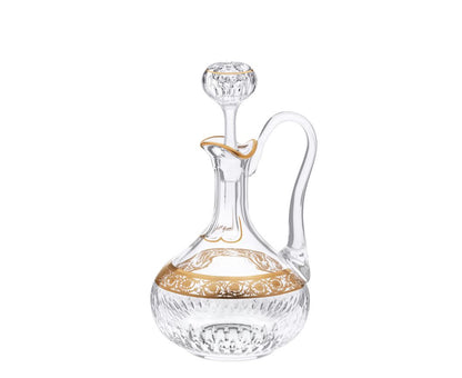 Thistle Crystal Wine Decanter With A Handle by Saint-Louis | Inspired by the Chardon service from 1913 | Features a plant motif engraved frieze decorated in fine gold | Venetian-style stripes, bevel cuts, and 24-carat gold or platinum decoration | Collection: Thistle | Color: Clear | Design: Timeless | Tableware and Decanters | 2Jour Concierge, your luxury lifestyle shop