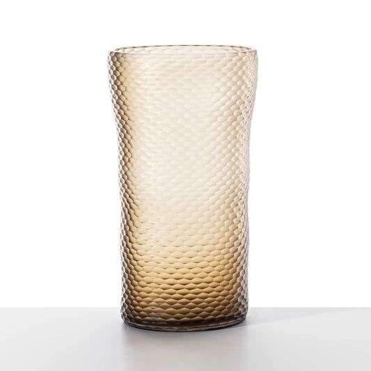 Venini Battuto a nido d’ape Vase | A Murano glass vase designed by Carlo Scarpa in 1940 | Features a textured surface of small, irregular hexagons inspired by natural honeycombs and ancient handcrafted textiles | Cold-sculpted by master glass grinders to create a unique, tactile pattern | Now available in the brand-new Peach variant | A harmonious blend of nature, craftsmanship, and timeless design | Design by Venini | Tableware & decorative objects | 2Jour Concierge, your luxury lifestyle shop