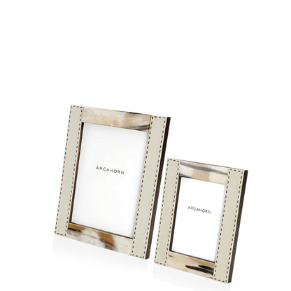 Arcahorn Dorotea Picture Frame | Glossy Horn and Aida Pebbled Leather in Ice-Cream with Handmade Dark Brown Stitching | Matte Amara Ebony Veneer Rim and Back | Designed by Filippo Dini | Ideal for Yachts and Offices | Explore Luxury Home Accessories at 2Jour Concierge, #1 luxury high-end gift & lifestyle shop