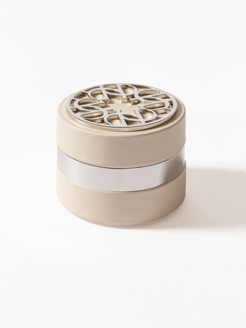 Giobagnara x Elie Saab Ecusson Paperweight | Leather paperweight with polished palladium details | Elie Saab monogram embedded on top | Luxurious and stylish desk accessory | Home Decor and Accessories | 2Jour Concierge, your luxury lifestyle shop