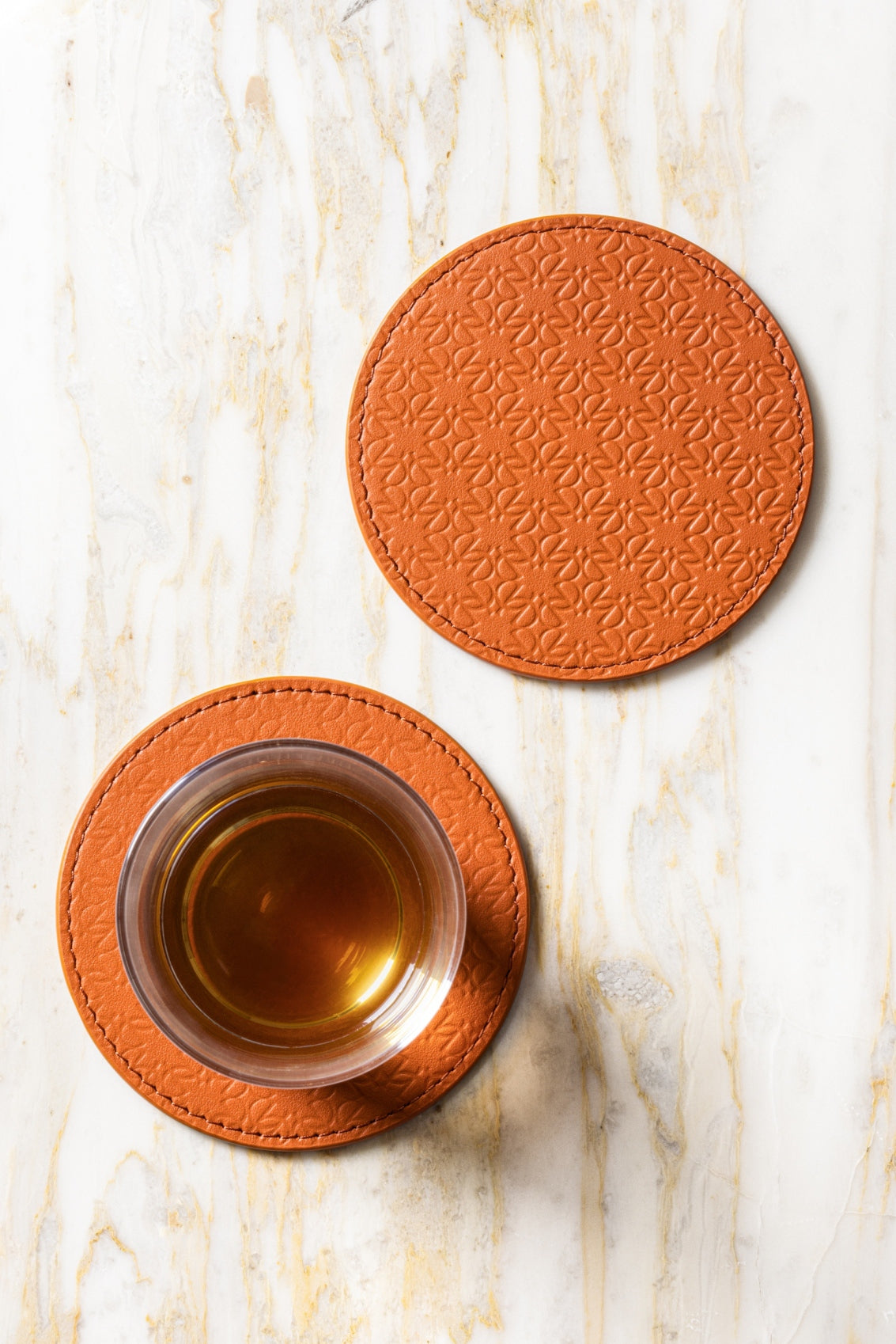 Giobagnara x Elie Saab Monogram Coasters (Set of 2) | Made of padded leather featuring the Elie Saab Monogram pattern | Elegant and stylish design | Perfect for protecting surfaces while adding a touch of luxury | Home Decor and Serveware | 2Jour Concierge, your luxury lifestyle shop