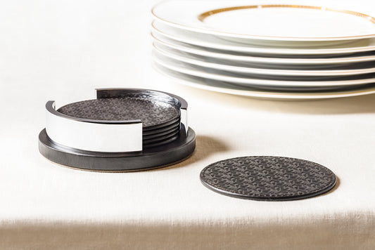Giobagnara x Elie Saab Monogram Coaster Holder with 6 Coasters | Leather coaster holder with polished palladium details | Includes 6 round coasters featuring the Elie Saab Monogram pattern | Elegant and practical design for stylish table settings | Home Decor and Serveware | 2Jour Concierge, your luxury lifestyle shop