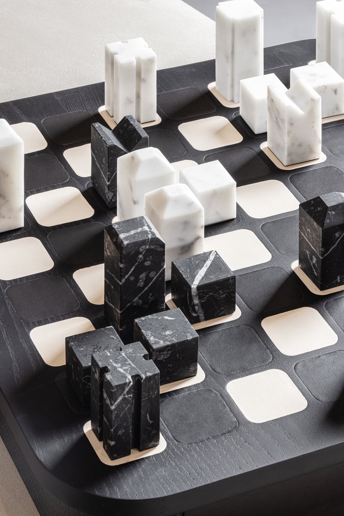 Giobagnara x Elie Saab Monogram Big Chess Game Set | Wood structure with fine leather inserts on top and a leather base featuring the Elie Saab Monogram pattern | Base encases magnetic drawers for storing playing pieces | Includes two sets of chess pieces made from white Carrara and black Marquinia marbles | Elegant and luxurious chess set | Home Decor and Games | 2Jour Concierge, your luxury lifestyle shop