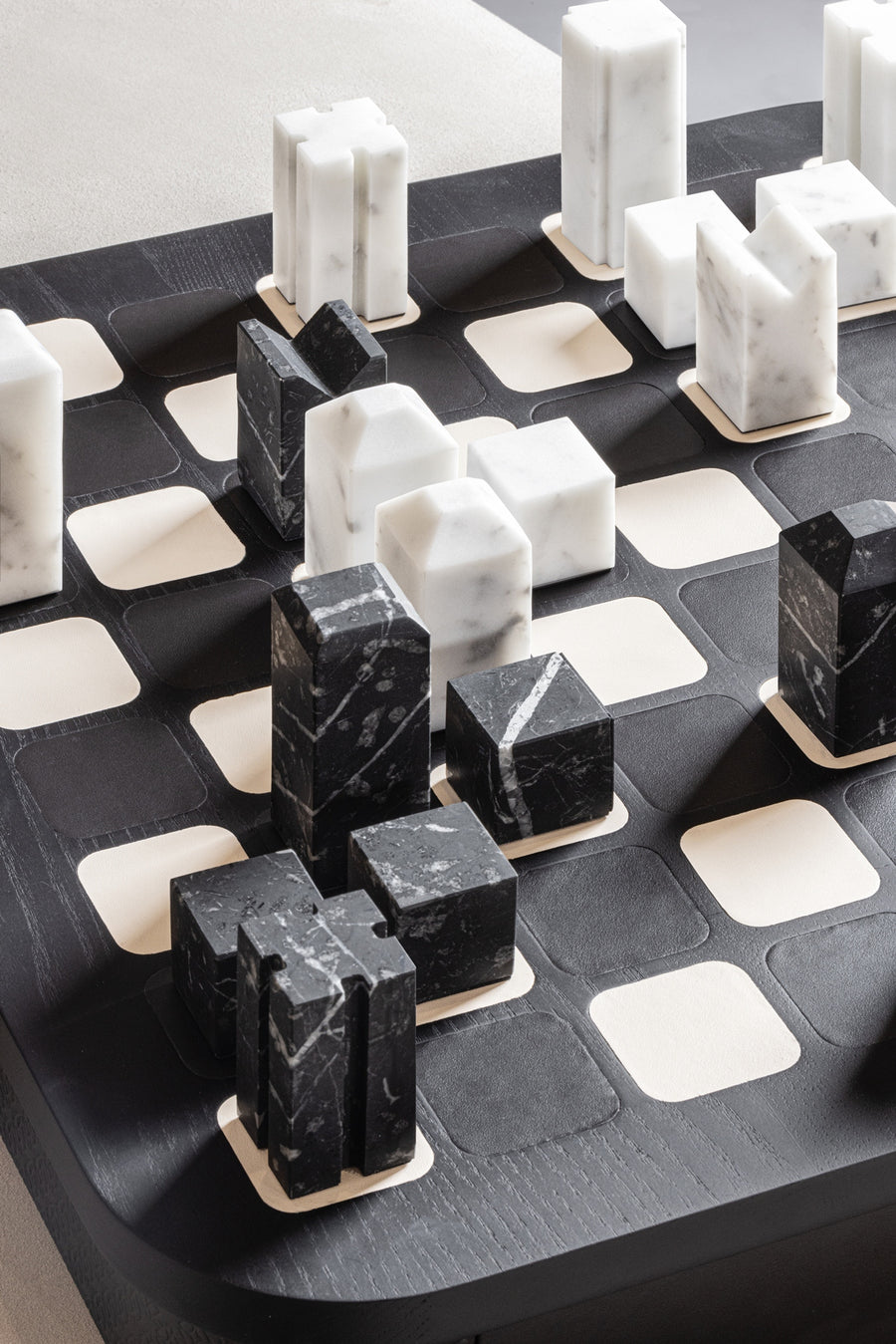 Giobagnara x Elie Saab Monogram Big Chess Game Set | Wood structure with fine leather inserts on top and a leather base featuring the Elie Saab Monogram pattern | Base encases magnetic drawers for storing playing pieces | Includes two sets of chess pieces made from white Carrara and black Marquinia marbles | Elegant and luxurious chess set | Home Decor and Games | 2Jour Concierge, your luxury lifestyle shop
