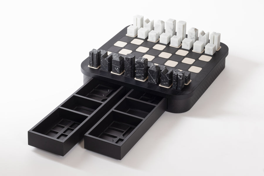 Giobagnara x Elie Saab Monogram Big Chess Game Set | Wood structure with fine leather inserts on top and a leather base featuring the Elie Saab Monogram pattern | Base encases magnetic drawers for storing playing pieces | Includes two sets of chess pieces made from white Carrara and black Marquinia marbles | Elegant and luxurious chess set | Home Decor and Games | 2Jour Concierge, your luxury lifestyle shop