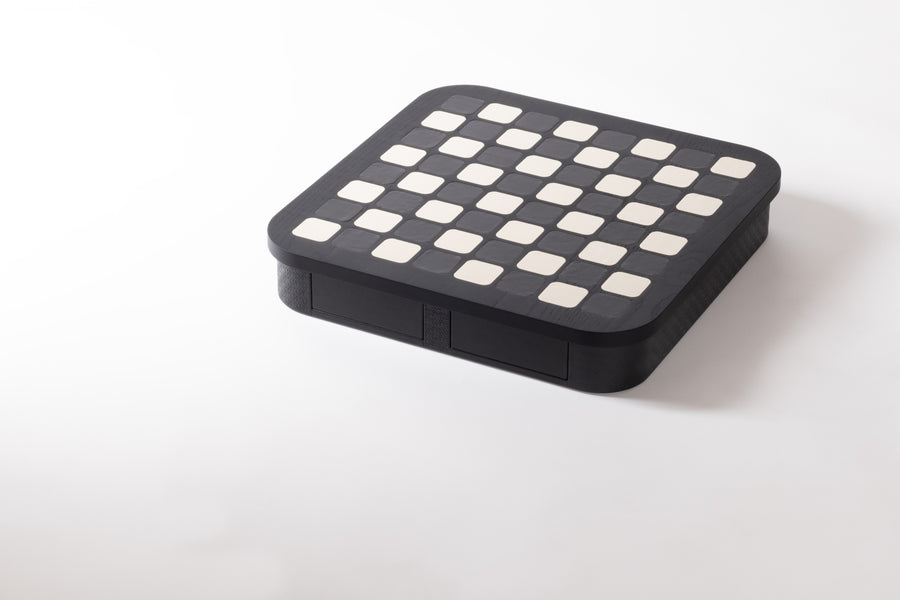 Giobagnara x Elie Saab Monogram Big Chess Game Set | Wood structure with fine leather inserts on top and a leather base featuring the Elie Saab Monogram pattern | Base encases magnetic drawers for storing playing pieces | Includes two sets of chess pieces made from white Carrara and black Marquinia marbles | Elegant and luxurious chess set | Home Decor and Games | 2Jour Concierge, your luxury lifestyle shop