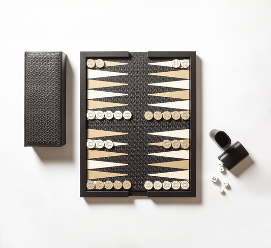 Giobagnara x Elie Saab Monogram Backgammon | Leather-covered tray with reversible leather pad: inlaid backgammon playing field on one side, sleek monochrome surface with Elie Saab Monogram pattern on the other | Includes a leather-covered wood box with coordinated leather cover | Contains playing accessories: polished palladium backgammon checkers with leather inserts and silver debossed decorations, 2 leather dice cups, 4 dice, and a doubling cube | Luxurious and elegant game set | Home Decor and Games