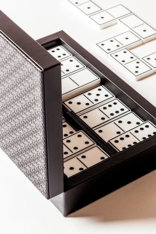 Giobagnara x Elie Saab Monogram Domino Game Set | Leather box with a hinged leather lid featuring the Elie Saab Monogram pattern | Equipped with highly resistant glossy plexiglass domino pieces | Games and Entertainment | 2Jour Concierge, your luxury lifestyle shop