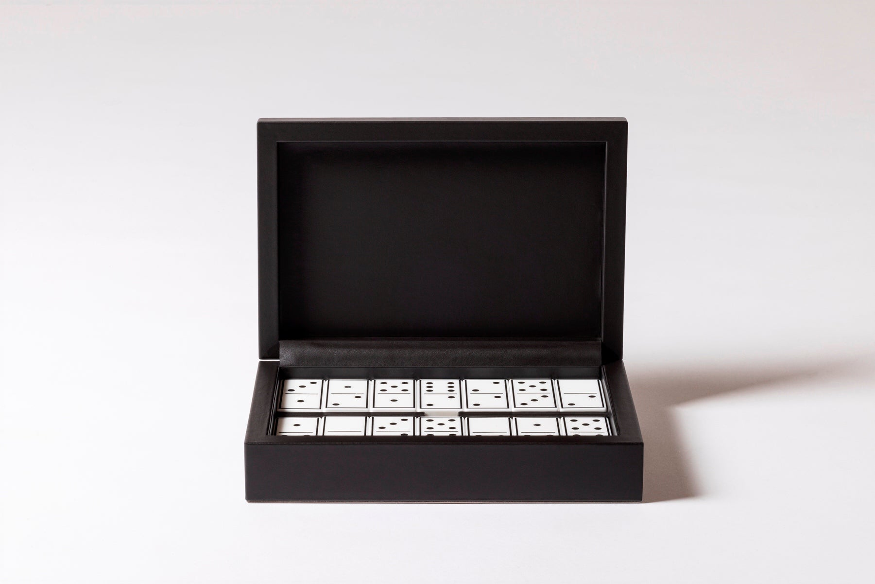Giobagnara x Elie Saab Monogram Domino Game Set | Leather box with a hinged leather lid featuring the Elie Saab Monogram pattern | Equipped with highly resistant glossy plexiglass domino pieces | Games and Entertainment | 2Jour Concierge, your luxury lifestyle shop