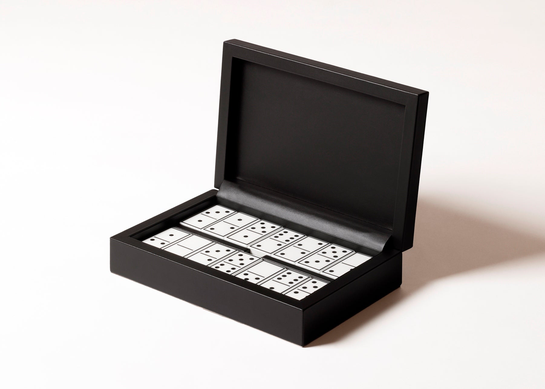 Giobagnara x Elie Saab Monogram Domino Game Set | Leather box with a hinged leather lid featuring the Elie Saab Monogram pattern | Equipped with highly resistant glossy plexiglass domino pieces | Games and Entertainment | 2Jour Concierge, your luxury lifestyle shop