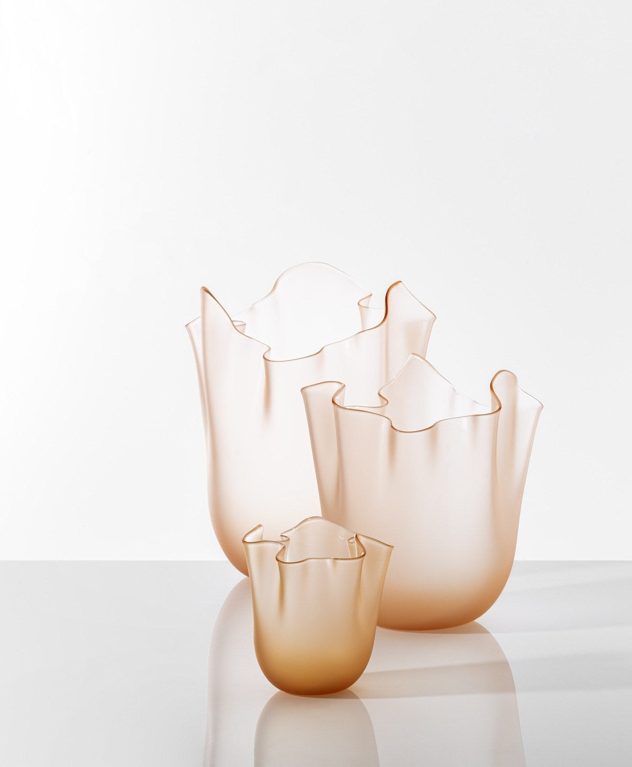Fazzoletto Vase by Venini | Soft shape with a wavy, moved hem, uniquely crafted with the flying hand technique | Designer: Fulvio Bianconi and Paolo Venini | Available in matte or glossy, opale or transparent finishes | Home Decor Vases | 2Jour Concierge, your luxury lifestyle shop