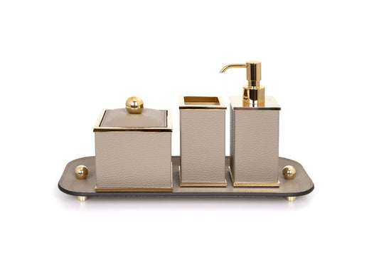 Olimpia Leather Covered Bathroom Set by Pinetti | Made in brass with shiny gold, burnished, or chromed finish | Consists of items available separately: soap dispenser, toothbrush holder, small box, large box | Home Decor Bathroom Accessories | 2Jour Concierge, your luxury lifestyle shop