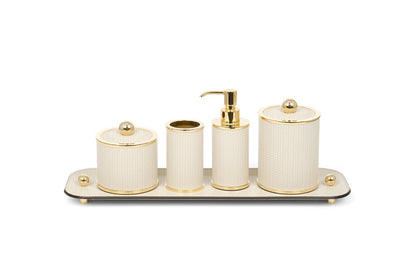 Olimpia Leather Covered Bathroom Set by Pinetti | Made in brass with shiny gold, burnished, or chromed finish | Consists of items available separately: soap dispenser, toothbrush holder, small box, large box | Home Decor Bathroom Accessories | 2Jour Concierge, your luxury lifestyle shop