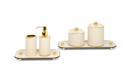 Olimpia Leather Covered Bathroom Set by Pinetti | Made in brass with shiny gold, burnished, or chromed finish | Consists of items available separately: soap dispenser, toothbrush holder, small box, large box | Home Decor Bathroom Accessories | 2Jour Concierge, your luxury lifestyle shop