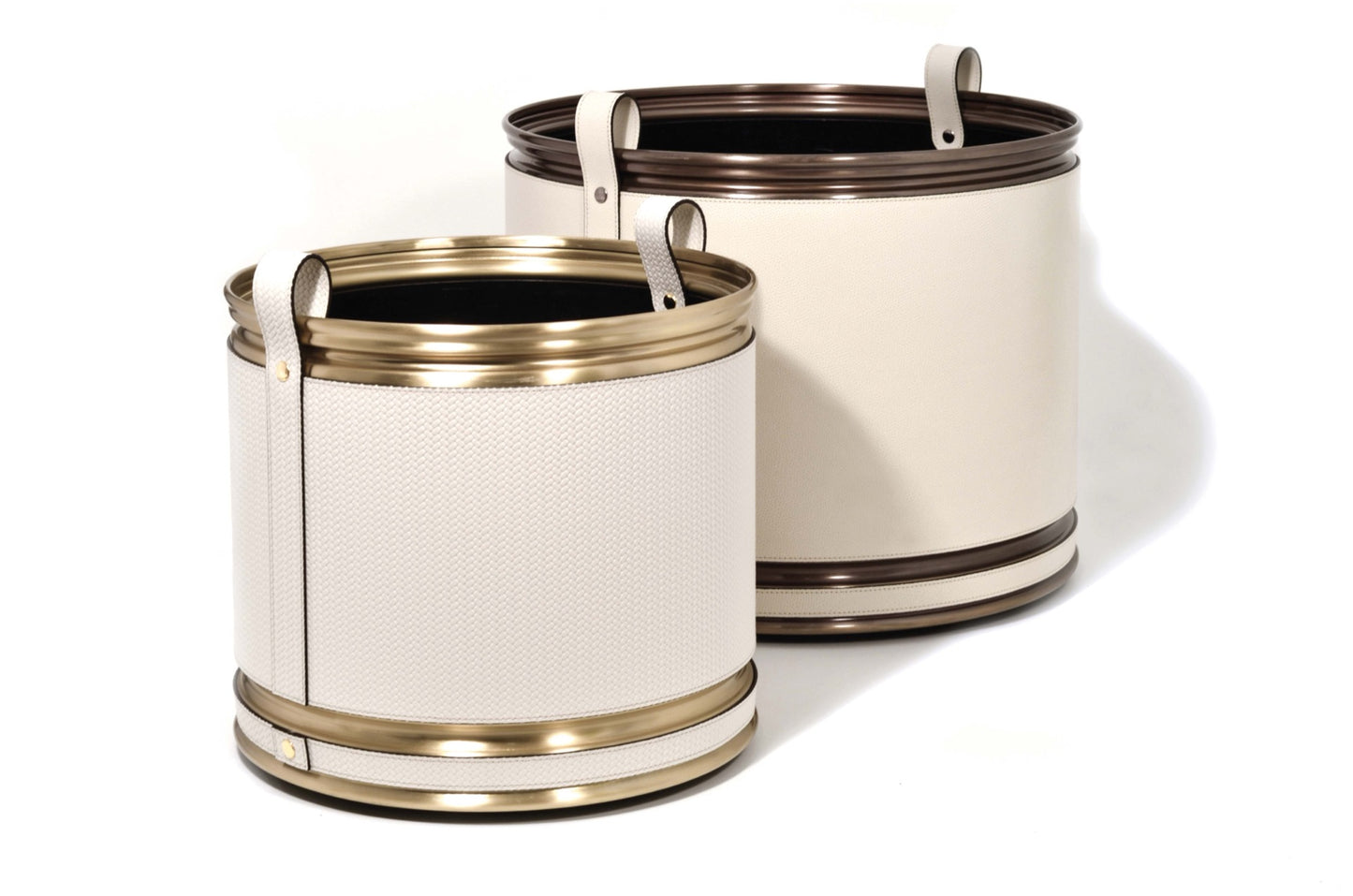 Pinetti | Leather-Covered Cachepot with Wheels: Leather-covered metal cachepot with handle and wheels, in two sizes and chrome, satin brass, or burnished finish | Living Room / Cachepots | 2Jour Concierge, your luxury lifestyle shop | luxury cachepot, designer plant pot cover, leather cachepot, Italian leather home accessories, premium indoor plant holder, Pinetti leather objects, high-end living room decor, leather plant pot, luxury interior planter, designer cachepot with wheels