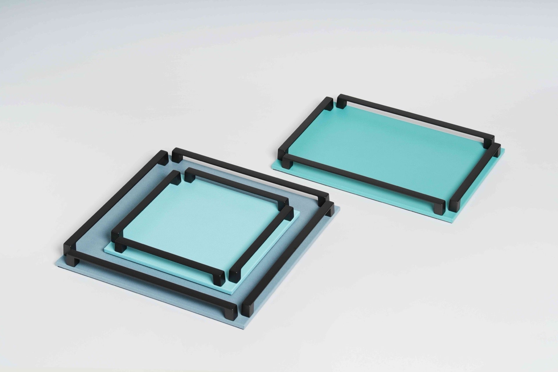 Pinetti Paul | Leather & Metal Trays: Wood base covered in leather, metal handles with chrome, burnished, or gold finish, non-slip base, available in multiple sizes | Tabletop & Bar / Trays | 2Jour Concierge, your luxury lifestyle shop | luxury interiors, refined dining, yacht décor, hospitality décor, elegant serving accessories, boutique hotels, office décor, contemporary living