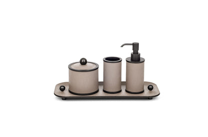 Olimpia Leather Covered Bathroom Set by Pinetti | Made in brass with shiny gold, burnished, or chromed finish | Consists of items available separately: soap dispenser, toothbrush holder, small box, large box | Home Decor Bathroom Accessories | 2Jour Concierge, your luxury lifestyle shop