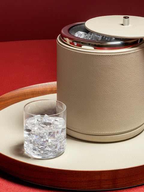 Giobagnara x Poltrona Frau ice bucket | Leather-covered wood structure with insulated double-chamber brass and stainless steel insert | Chrome-plated finish ensures beverages stay chilled for hours | Ideal for both casual and special occasions | Entirely made in Pelle Frau® | Barware & accessories | 2Jour Concierge, your luxury lifestyle shop