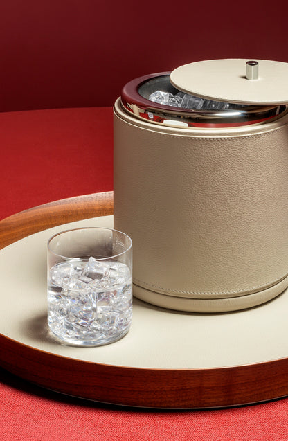 Giobagnara x Poltrona Frau ice bucket | Leather-covered wood structure with insulated double-chamber brass and stainless steel insert | Chrome-plated finish ensures beverages stay chilled for hours | Ideal for both casual and special occasions | Entirely made in Pelle Frau® | Barware & accessories | 2Jour Concierge, your luxury lifestyle shop
