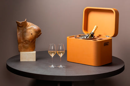 Giobagnara x Poltrona Frau champagne trunk | Luxurious leather-covered structure with hinged lid, walnut wood inlay, and elegant detailing | Includes two master glasses and a champagne bucket with insulated double-chamber polished steel insert | Entirely made in Pelle Frau® | Barware & trunks | 2Jour Concierge, your luxury lifestyle shop