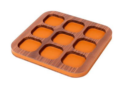 Giobagnara x Poltrona Frau tic tac toe | Leather-covered playing pieces with inlaid graphic motifs | Walnut wood base adorned with refined leather detailing | A luxurious twist on a classic game | Entirely made in Pelle Frau® | Home decor & game sets | 2Jour Concierge, your luxury lifestyle shop