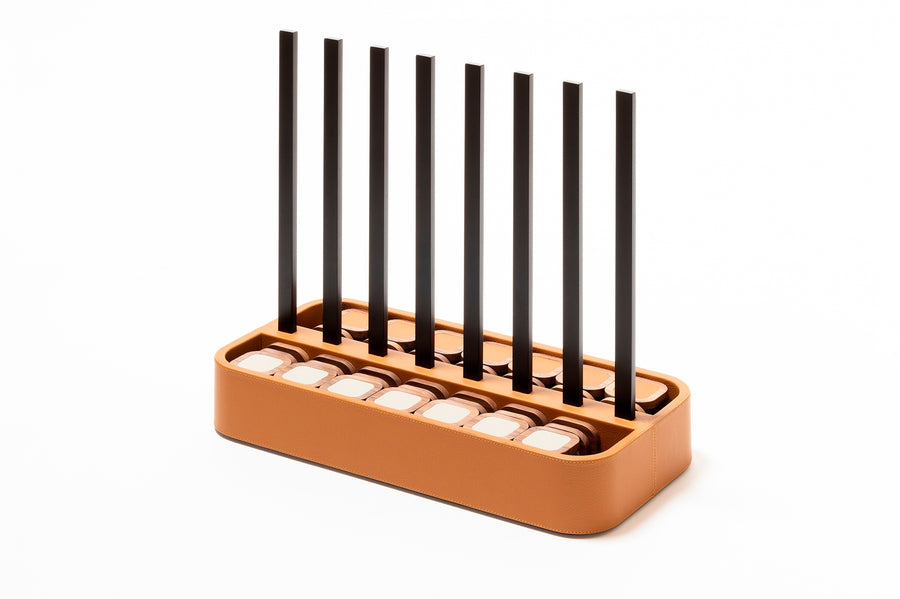Giobagnara x Poltrona Frau connect 4 | Leather-covered base with walnut wood playing pieces featuring fine leather inserts | Accented with burnished brushed bronze details | A stylish, elevated take on a timeless game | Entirely made in Pelle Frau® | Home decor & game sets | 2Jour Concierge, your luxury lifestyle shop