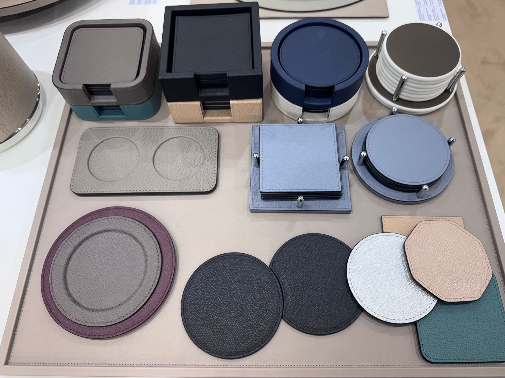 Collection of various coasters on a display tray