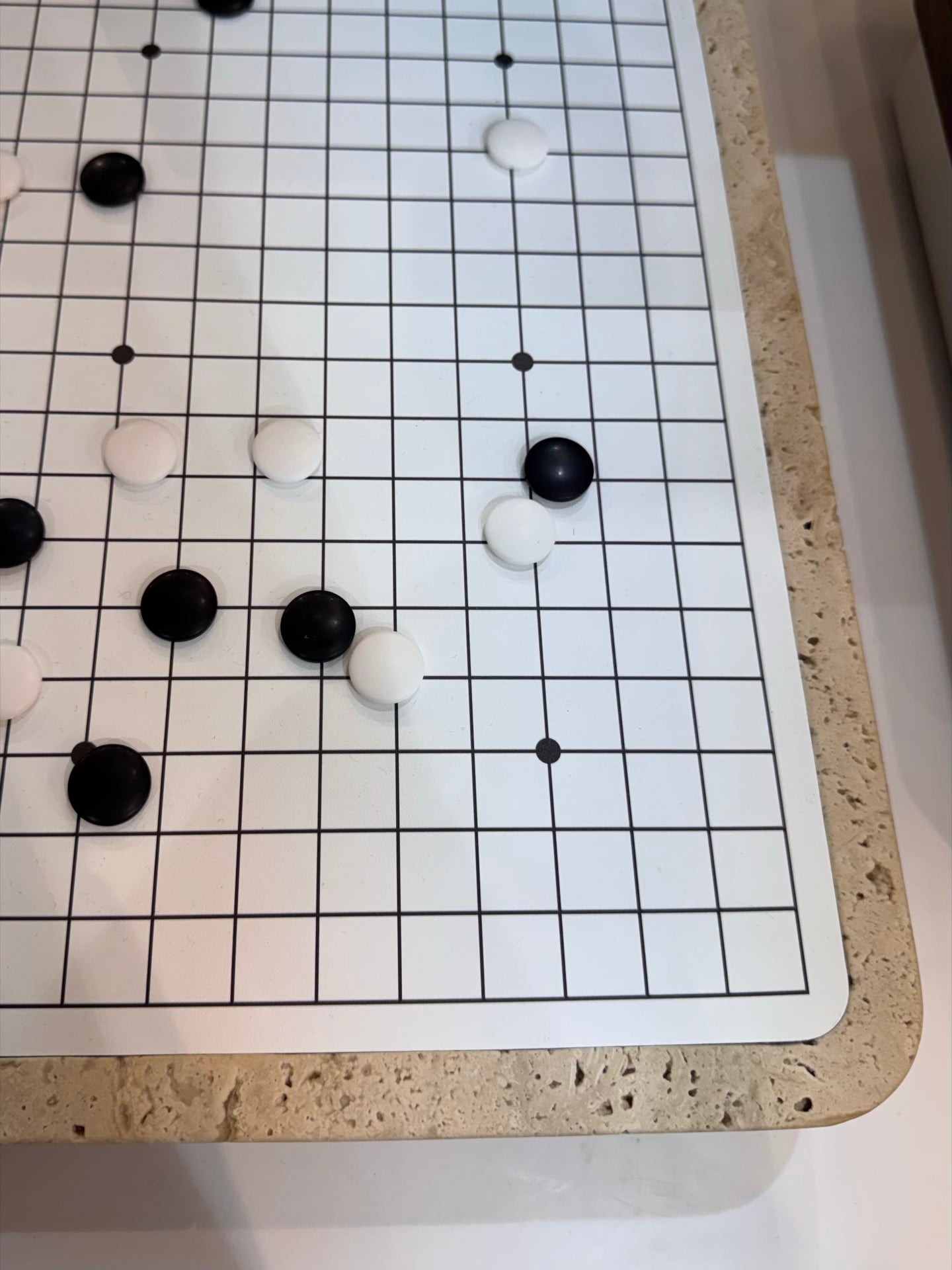 Giobagnara | Delos Go Game Set Marble: Arabescato white or travertino top with digital-printed leather playing field and Corian® beads | Game Room | 2Jour Concierge, your luxury lifestyle shop | luxury go game marble, Giobagnara Delos, marble game board, Italian designer game set