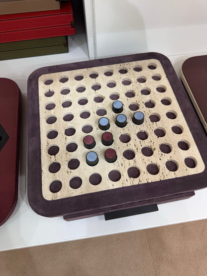 Giobagnara | Delos Othello Game Set Marble: Arabescato white or travertino leather-covered board with metal playing pieces and leather inserts | Game Room | 2Jour Concierge, your luxury lifestyle shop | luxury othello marble, Giobagnara Delos, marble game board, Italian designer game
