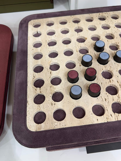Giobagnara | Delos Othello Game Set Marble: Arabescato white or travertino leather-covered board with metal playing pieces and leather inserts | Game Room | 2Jour Concierge, your luxury lifestyle shop | luxury othello marble, Giobagnara Delos, marble game board, Italian designer game