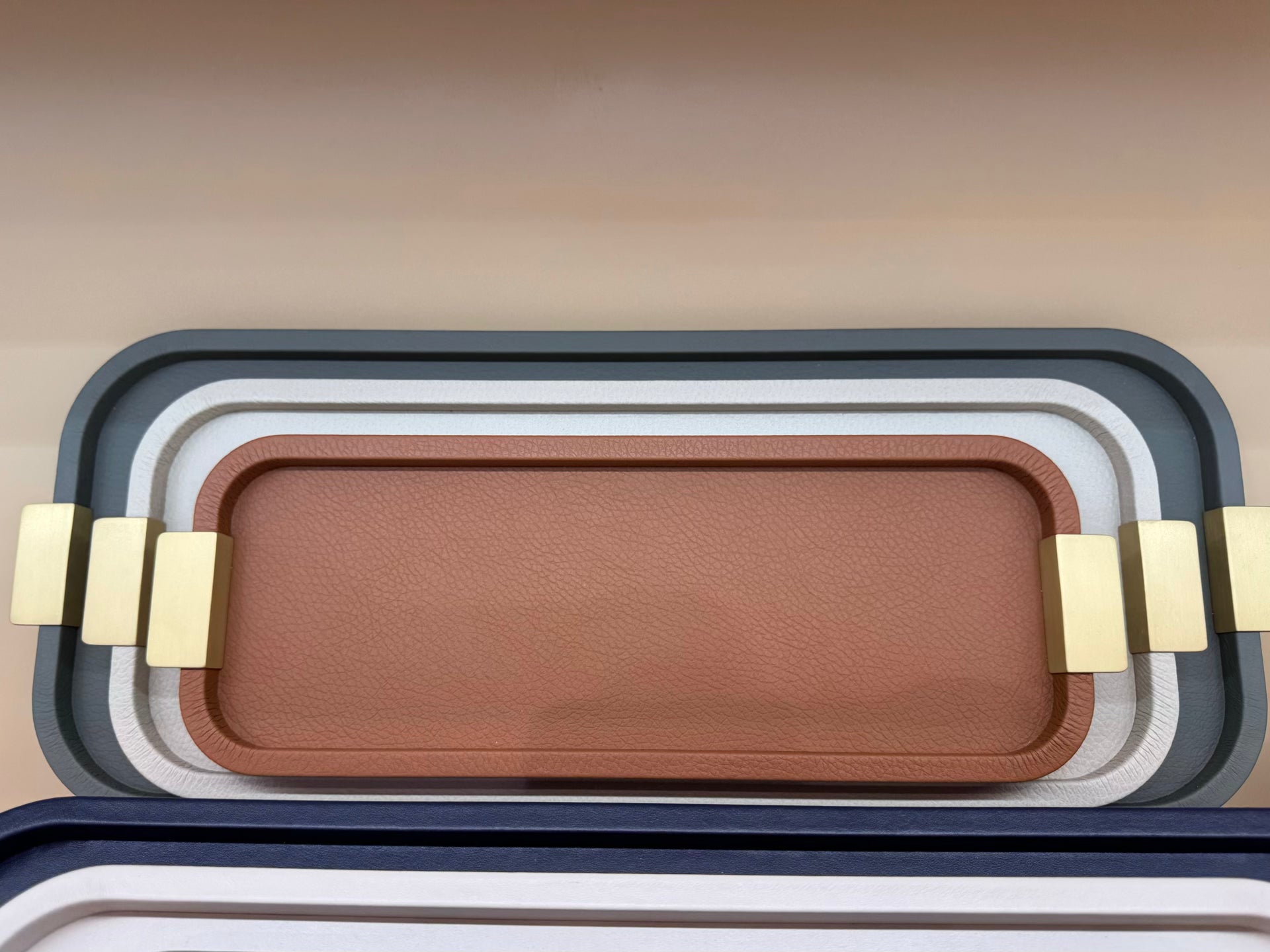 Giobagnara | Puccini Long Rectangular Tray: Leather-covered wood tray with metal handles in chrome, bronze, or brass | Serveware | 2Jour Concierge, your luxury lifestyle shop | luxury serving tray, Giobagnara Puccini, leather tray with handles, Italian designer tray, long rectangular tray