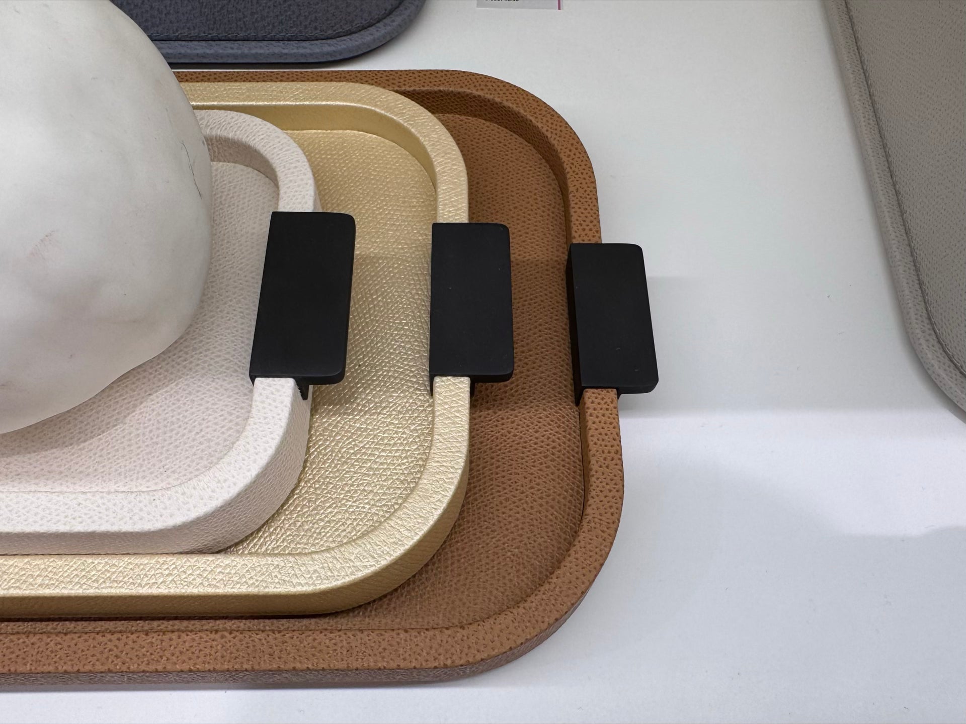 Giobagnara | Puccini Long Rectangular Tray: Leather-covered wood tray with metal handles in chrome, bronze, or brass | Serveware | 2Jour Concierge, your luxury lifestyle shop | luxury serving tray, Giobagnara Puccini, leather tray with handles, Italian designer tray, long rectangular tray