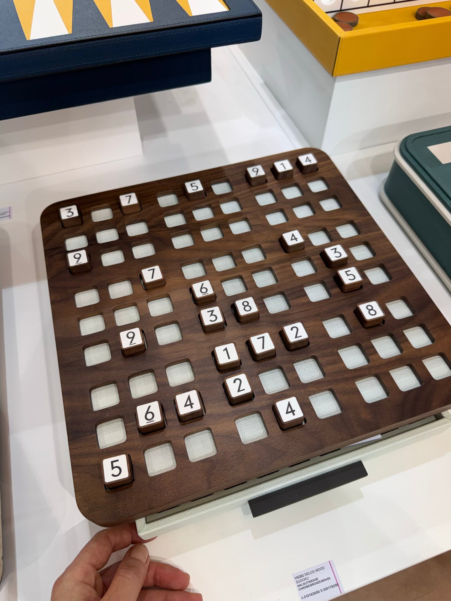 Giobagnara | Delos Sudoku Game Set Wood: Walnut or wengé board with 81 wood playing pieces and digital-printed leather inserts | Game Room | 2Jour Concierge, your luxury lifestyle shop | luxury sudoku wood, Giobagnara Delos, walnut sudoku board, Italian designer puzzle