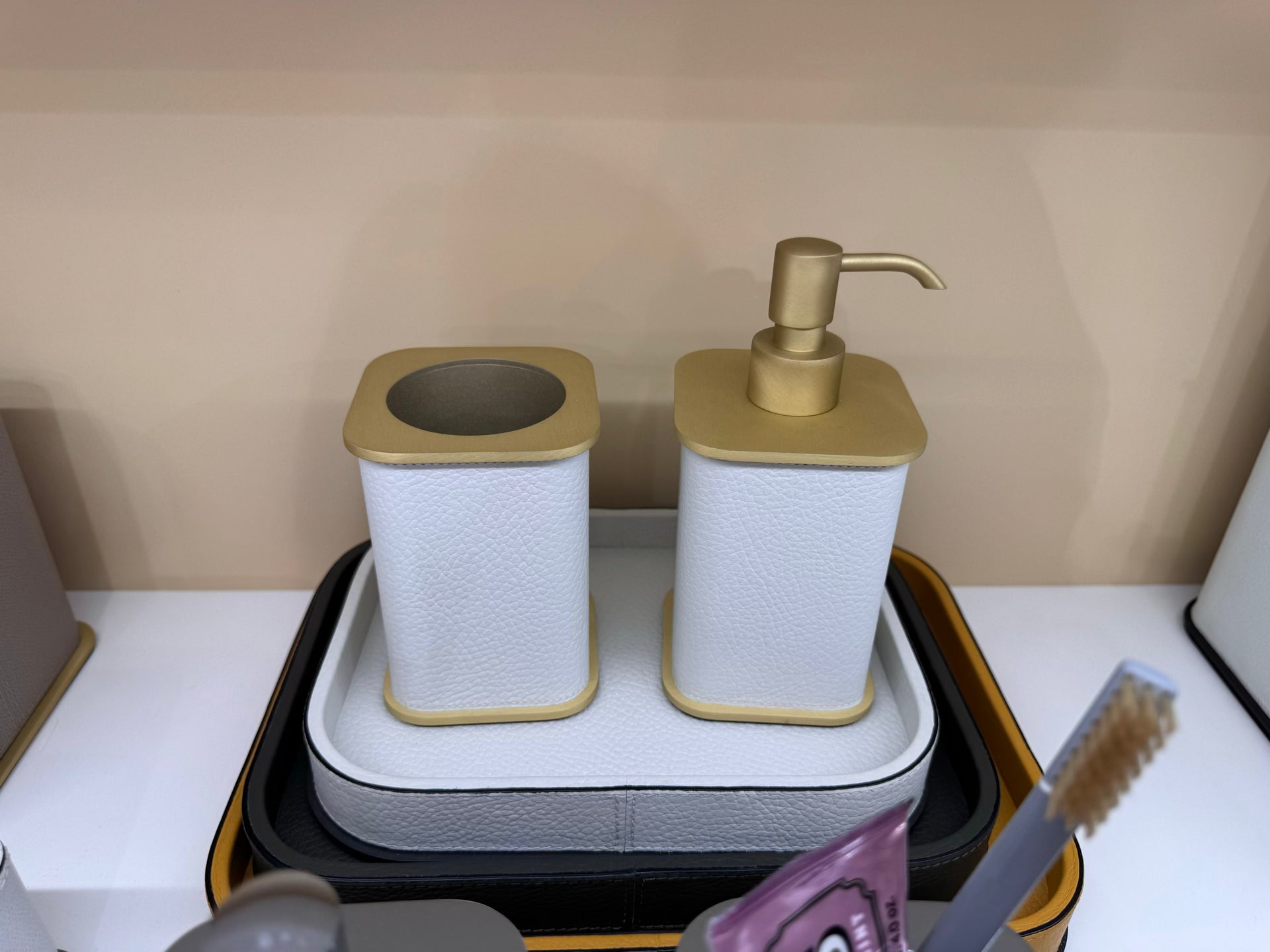 Giobagnara | Polo Leather Bathroom Set: Leather-covered body with rounded silhouette and metal pump in chrome, bronze, or brass | The Bathroom | 2Jour Concierge, your luxury lifestyle shop | luxury soap dispenser, Giobagnara Polo, leather bathroom accessory, Italian designer soap dispenser