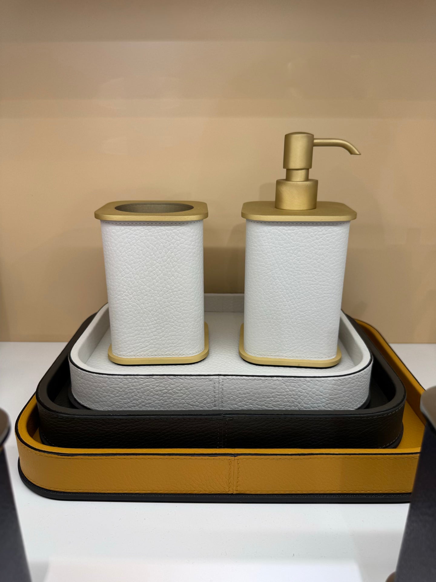 Giobagnara | Polo Leather Bathroom Set: Leather-covered body with rounded silhouette and metal pump in chrome, bronze, or brass | The Bathroom | 2Jour Concierge, your luxury lifestyle shop | luxury soap dispenser, Giobagnara Polo, leather bathroom accessory, Italian designer soap dispenser