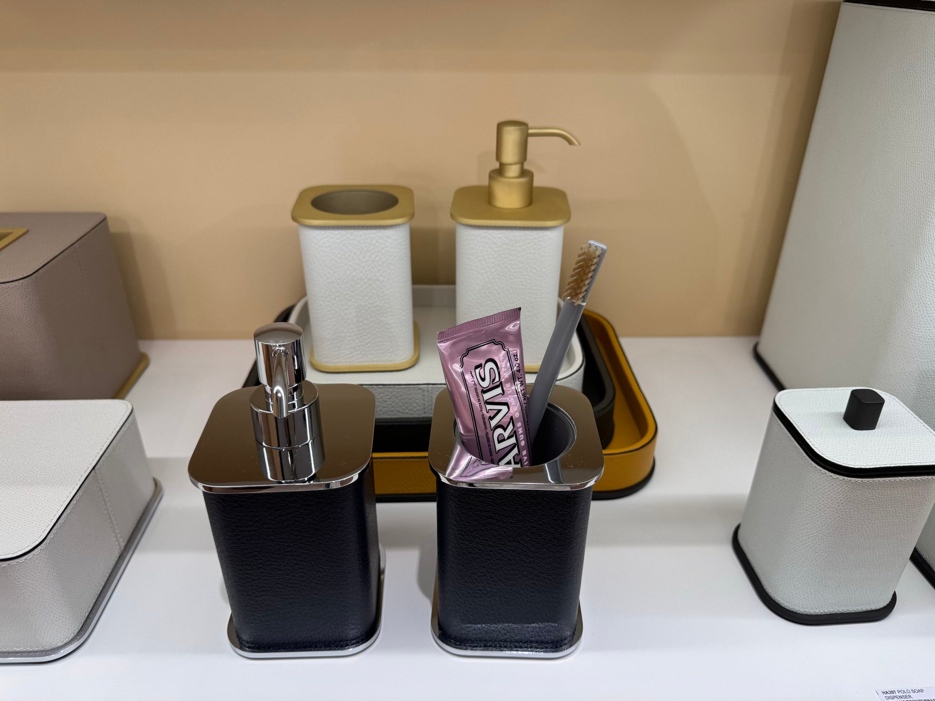 Giobagnara | Polo Leather Bathroom Set: Leather-covered body with rounded silhouette and metal pump in chrome, bronze, or brass | The Bathroom | 2Jour Concierge, your luxury lifestyle shop | luxury soap dispenser, Giobagnara Polo, leather bathroom accessory, Italian designer soap dispenser